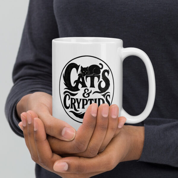 white-glossy-mug-white-15-oz-handle-on-right-693de626bd71b.jpg Cats & Cryptids 15oz Mug